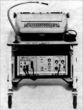 Figure 1. The Patient Operated Selector Mechanism (POSM) provided multiple ways to control a standard typewriter. Shown here is one that allowed control through sip and puff on a gooseneck mounted mouthpiece.